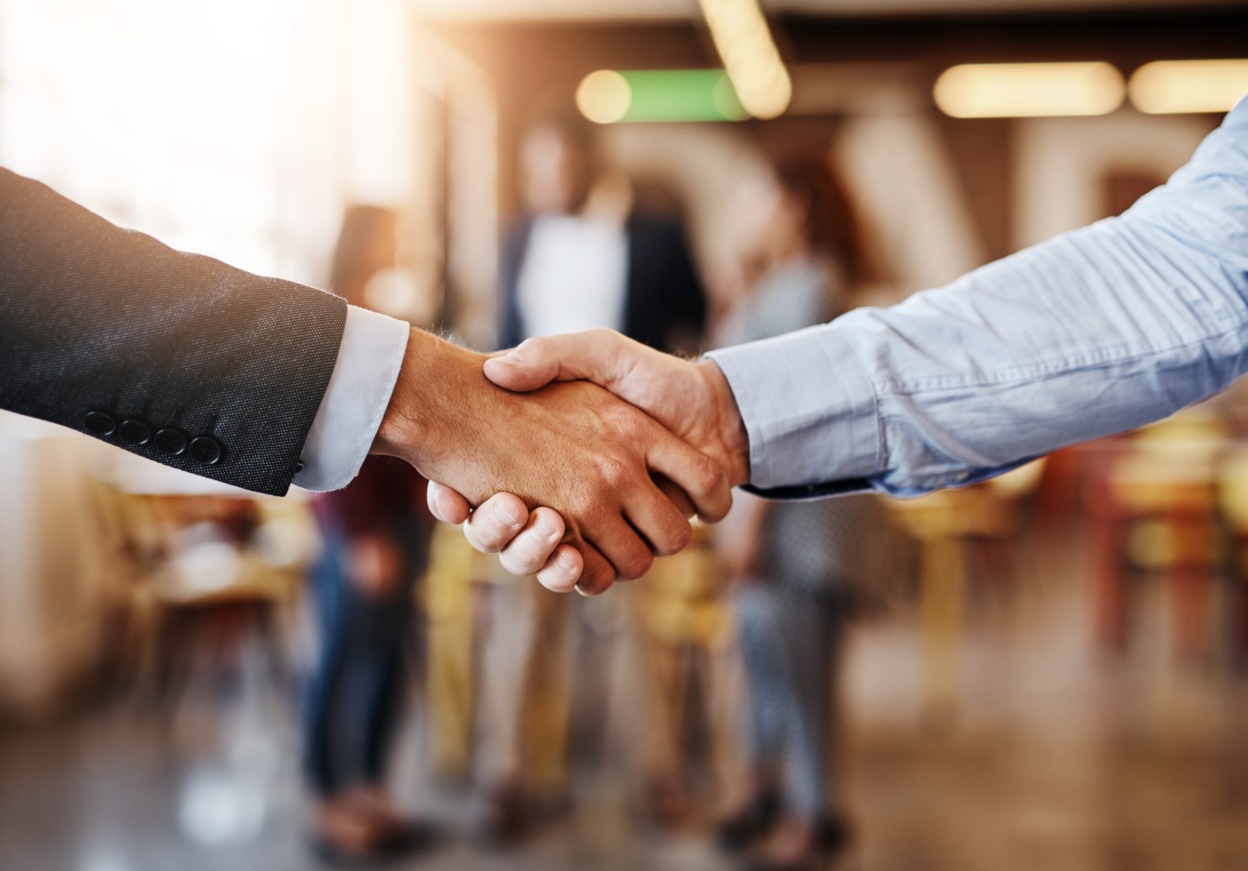teamwork and shaking hands before a meeting